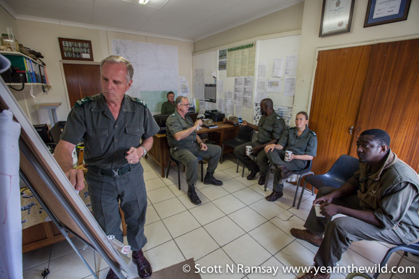 General Jooste (left) briefs some of Kruger's section rangers, who are at the frontlines of the war against poachers.