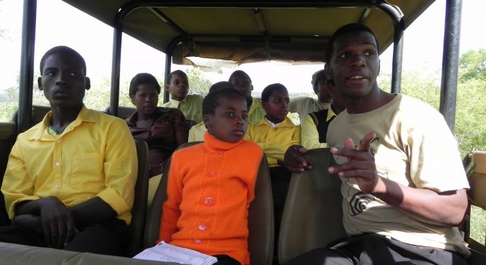 Community Conservation Liaison Sboniso Mazolo on a kid’s game drive