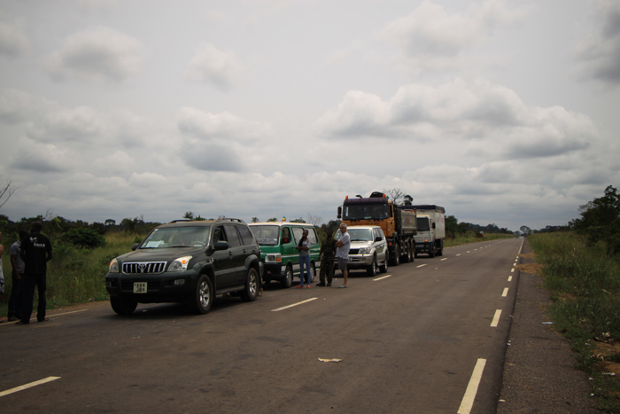 2. Vehicles line up at Yengo-Mambili check point. A team of eco-guards from Odzala-Koukoua National Park permanently mans Yengo-Mambili control post. The boom gate is the only permanent wildlife product focused control post on the main road from northern Congo to the urban areas in the south.