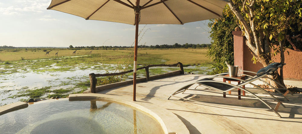 The fabulous hot tub at Kafunta River Lodge, fed by a natural hot spring and looking out over the game rich floodplain.