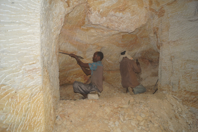 Workmen chiselling rock in Ethiopia