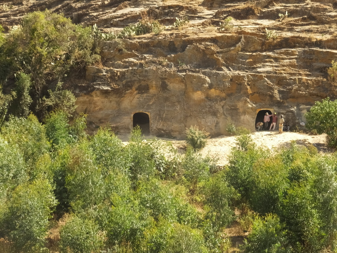 Large rock face with two entrances