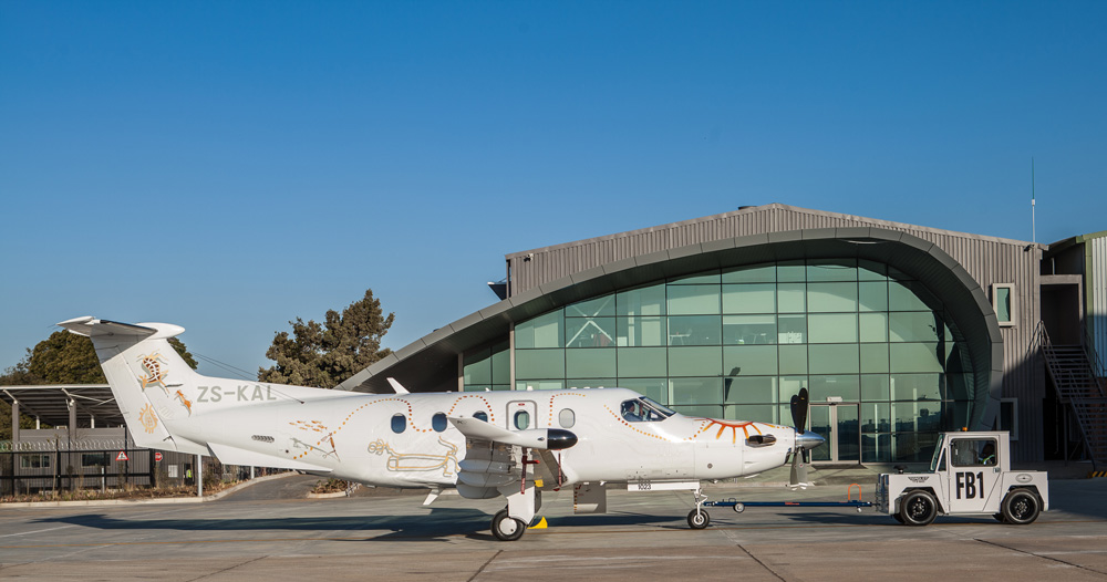 A private jet outside a hangar