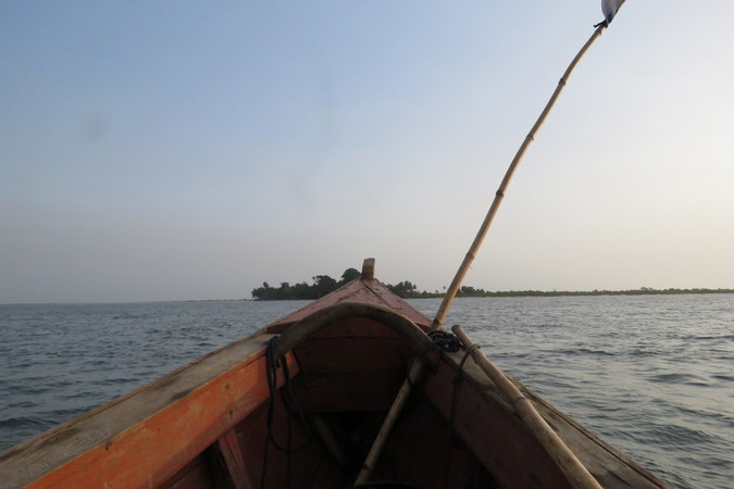 Boat approaching Bakei, Turtle Islands, Sierra Leone