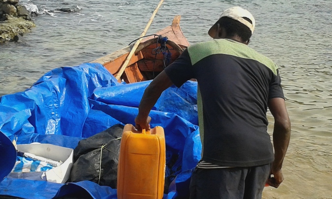 Mr Moses preparing the boat for Turtle Islands, Sierra Leone