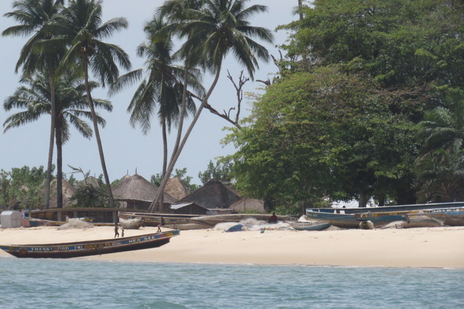 Boats and village at Bumpetuk, Turtle Islands, Sierra Leone