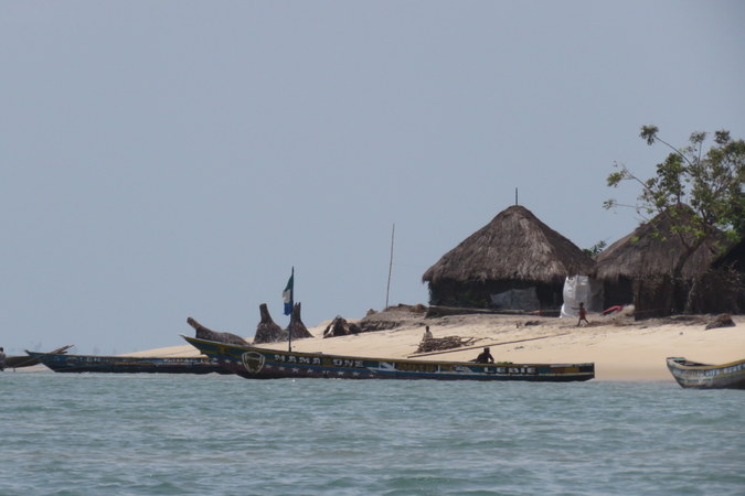 Boats, village and huts on Bumpetuk, Turtle Islands, Sierra Leone