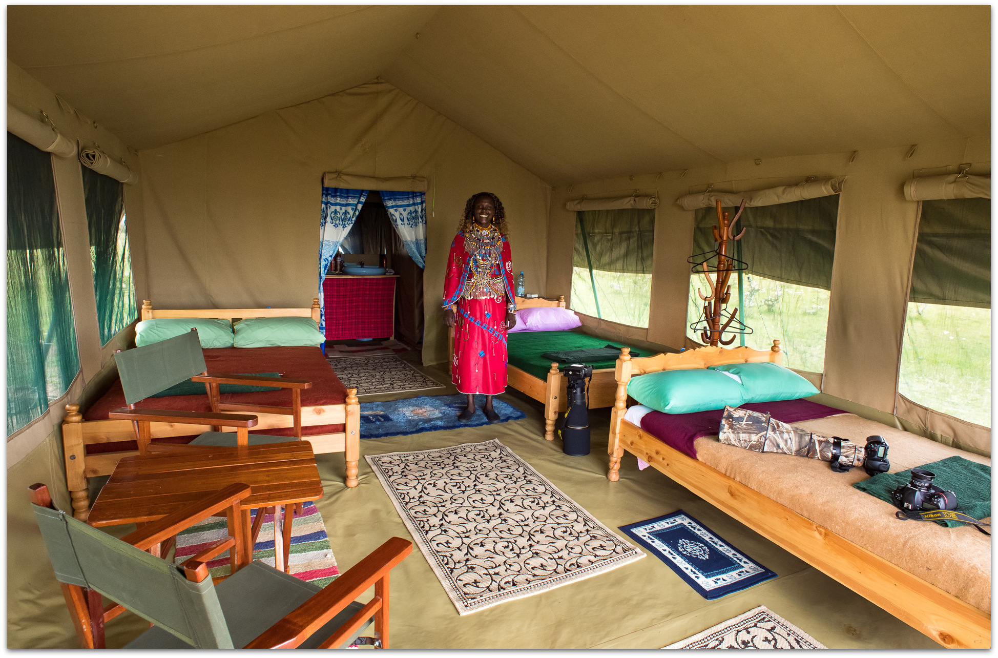 Inside a tent in the Maasai Mara with Maasai woman