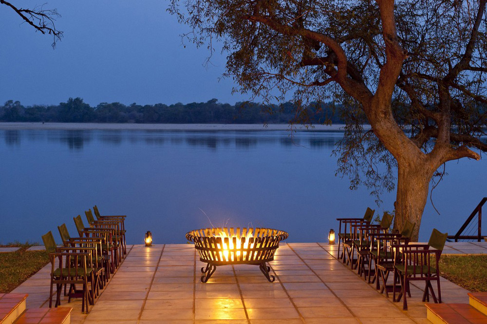 Zambezi River with firepit in foreground at sunset