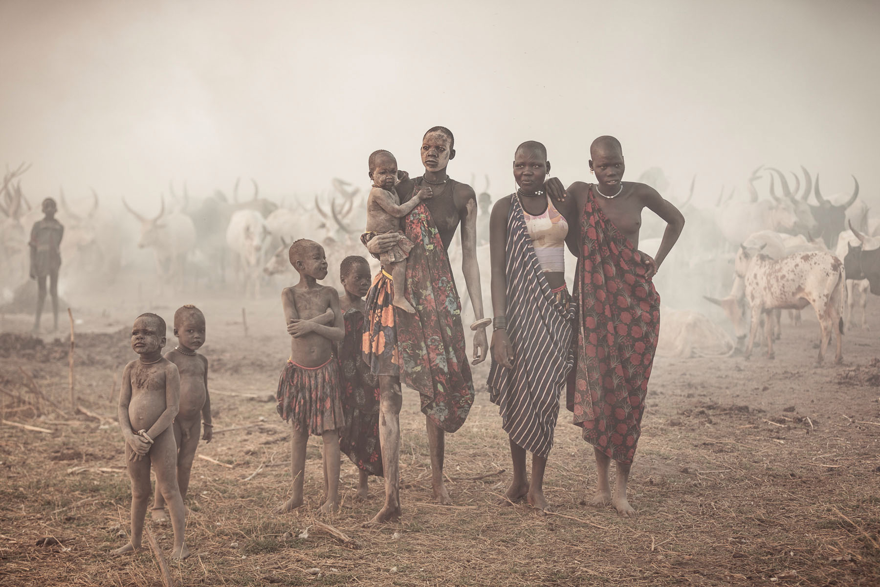 Mundari woman and children at sunrise © Joe Buergi