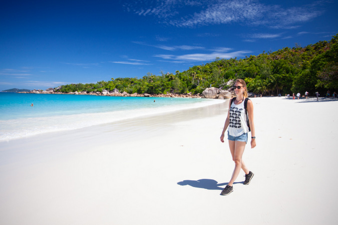 Walking on the beach on Praslin in the Seychelles