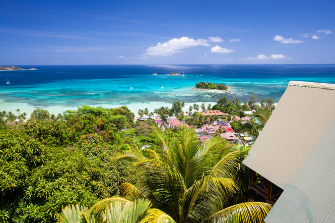 The blue, tropical waters of Praslin in the Seychelles