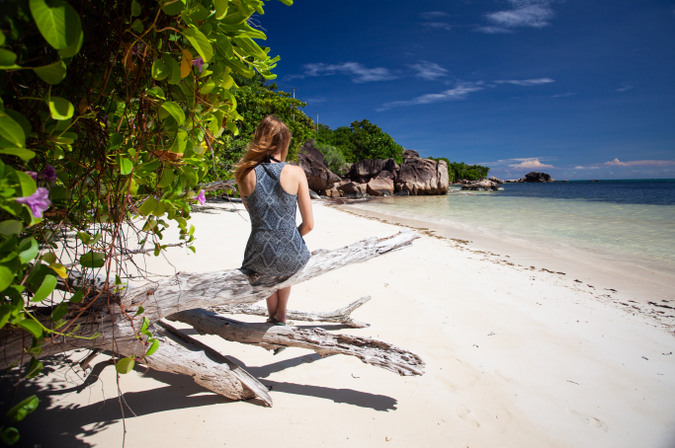 Sitting on the beach in Praslin in the Seychelles 