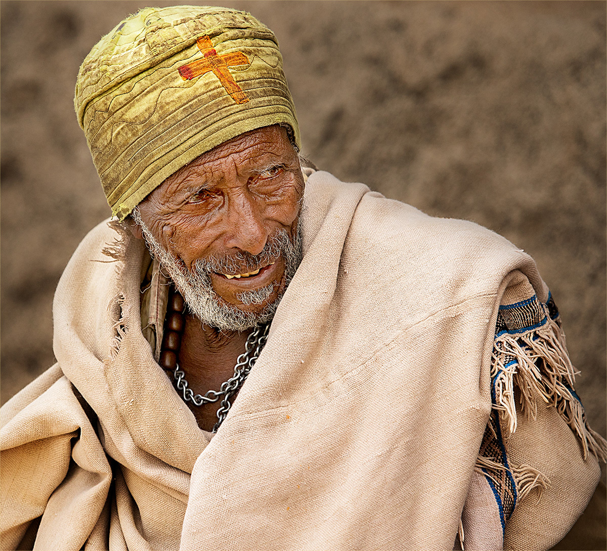 An old man in his church clothes on his way to church, Lalibela, Ethiopia © Hesté de Beer