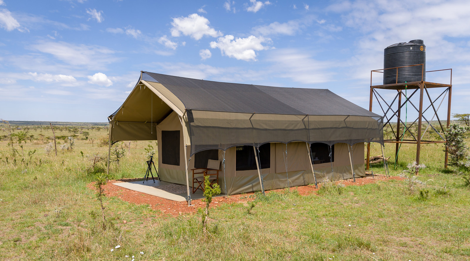 Maasai Mara "The camp was just perfect for my needs: a very large tent all to myself, a flushing toilet, a shower with hot and cold water, and a solar energy battery charger." © Ruzdi Ekenheim