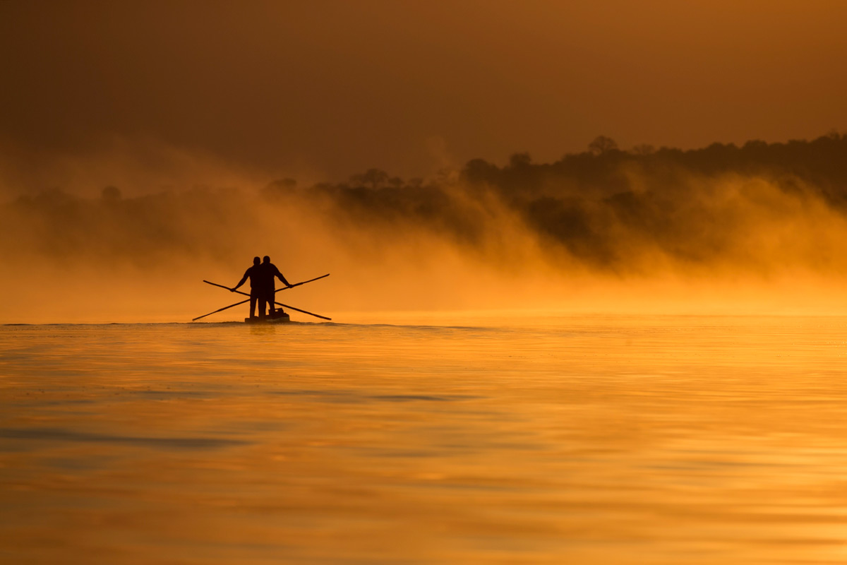 Fishermen at sunrise on the Chobe River, Chobe, Botswana © Johan Van Rensburg