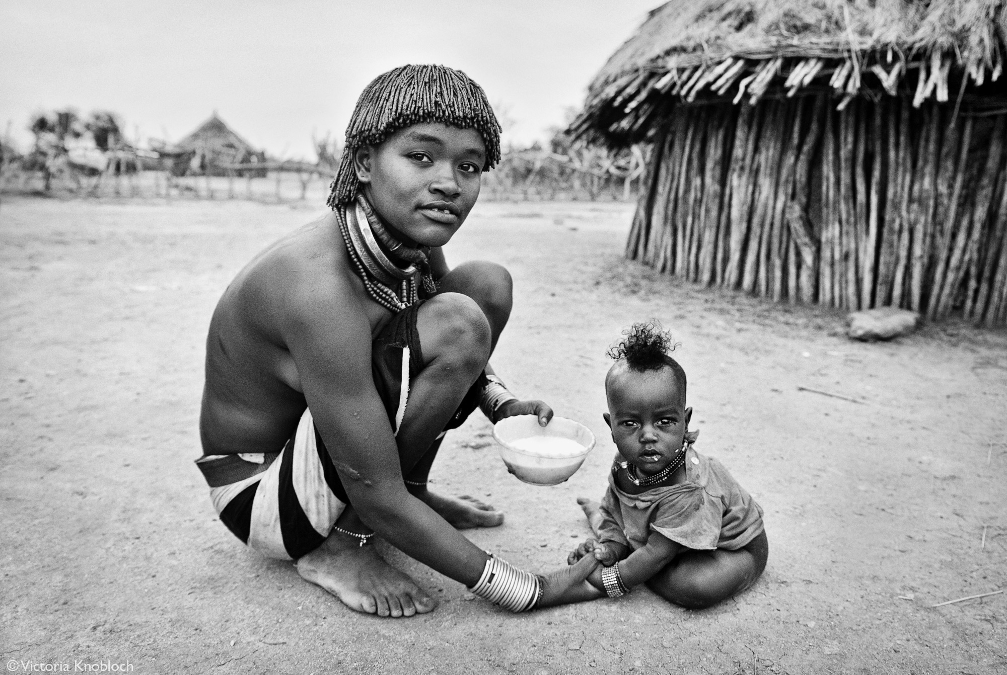 Hamer tribe mother feeding her child, Omo Valley, Ethiopia