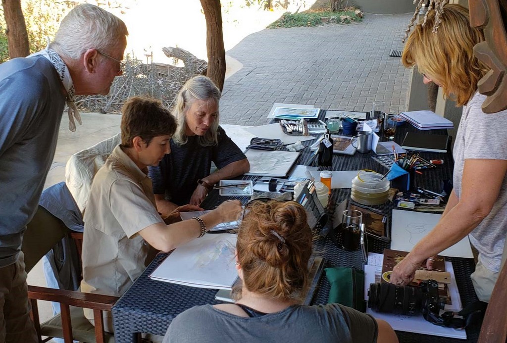 Artist looking at their work at a lodge in Greater Kruger, South Africa