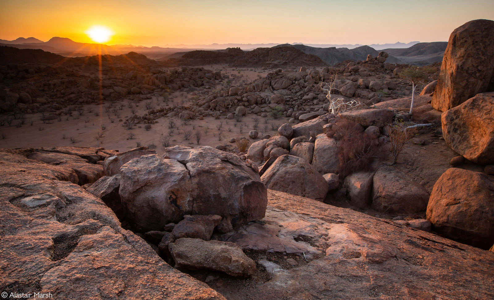 Sunset across the Namib Desert from Mowani Mountain Camp. Damaraland, Namibia © Alastair Marsh