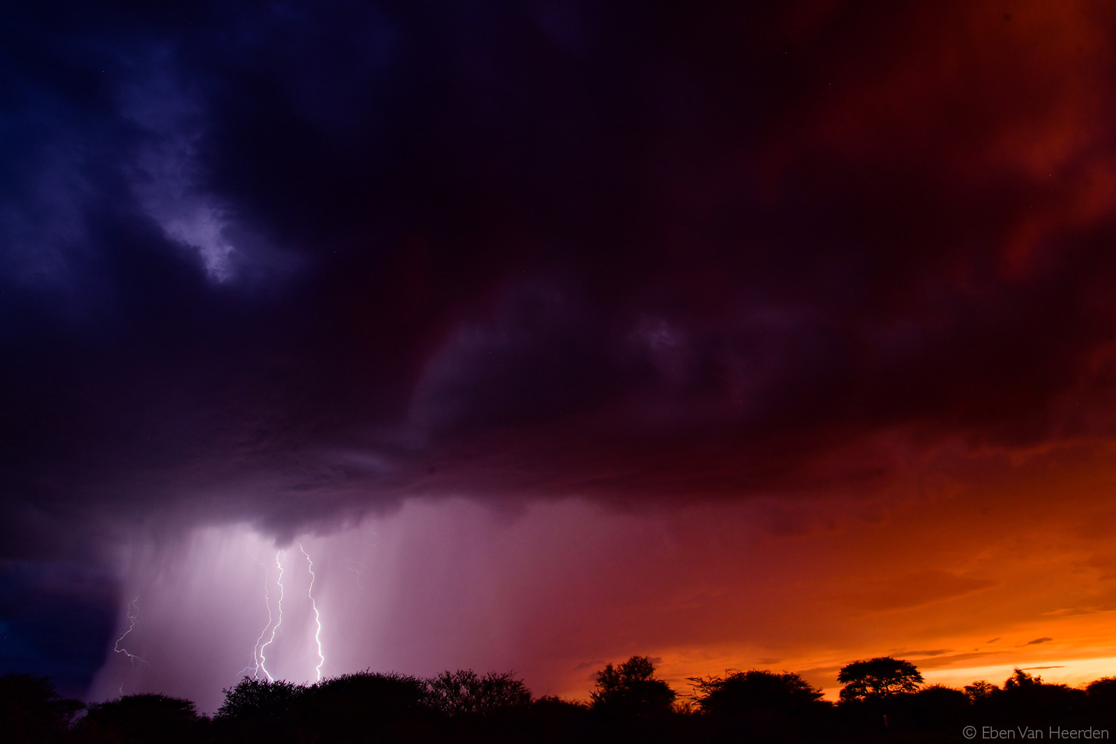 Lightning strikes as the sun sets. Kalahari Desert, Botswana © Eben Van Heerden