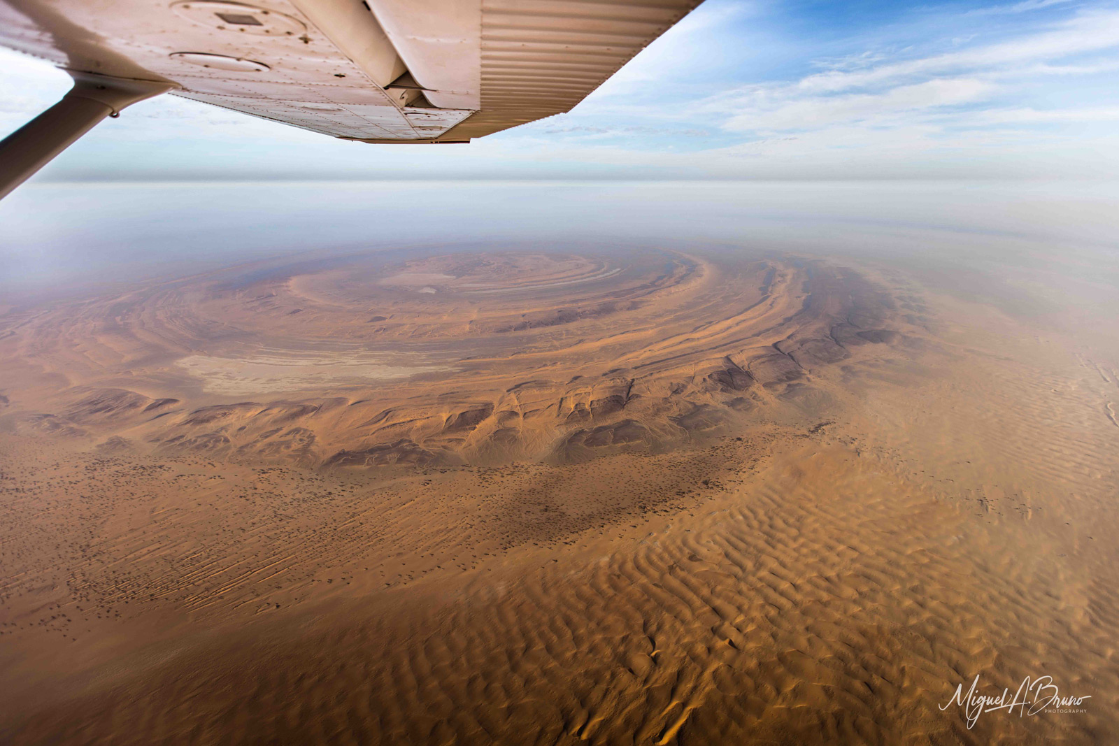 A scenic flight above the 'Eye of Sahara'. Chinguetti, Mauritania © Miguel Bruno